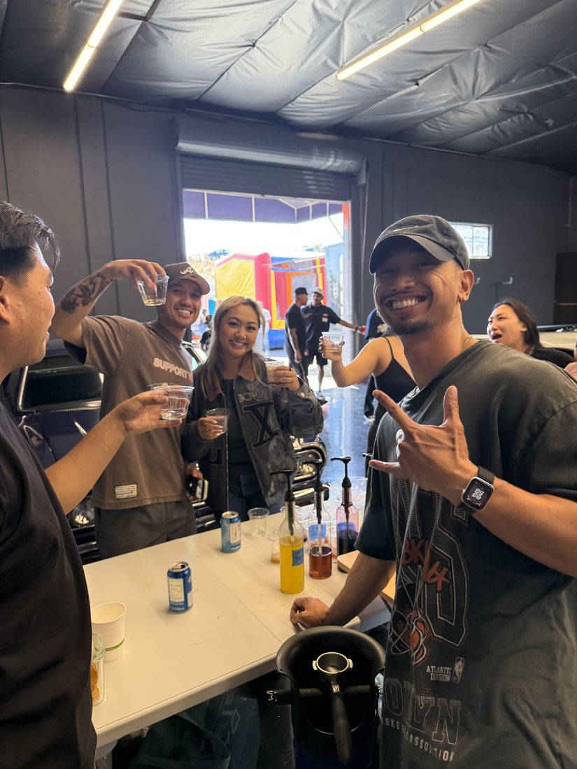 Guests holding Lakwatsa drinks at an event